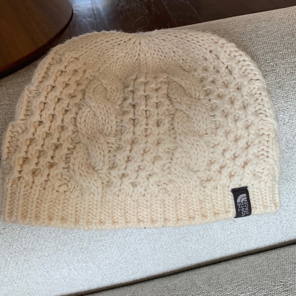 Woman winter hat. Cable knit. Brand The North Face